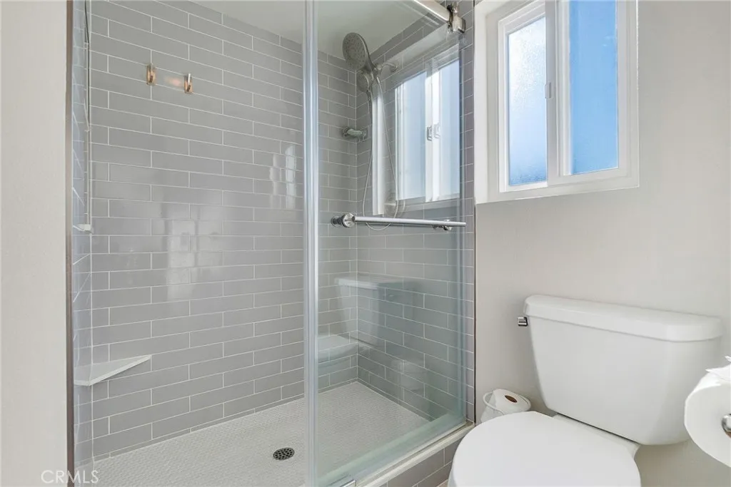 Private ensuite walk in shower and toilet area including dual pane window. Private ensuite walk in shower and toilet area including dual pane window.