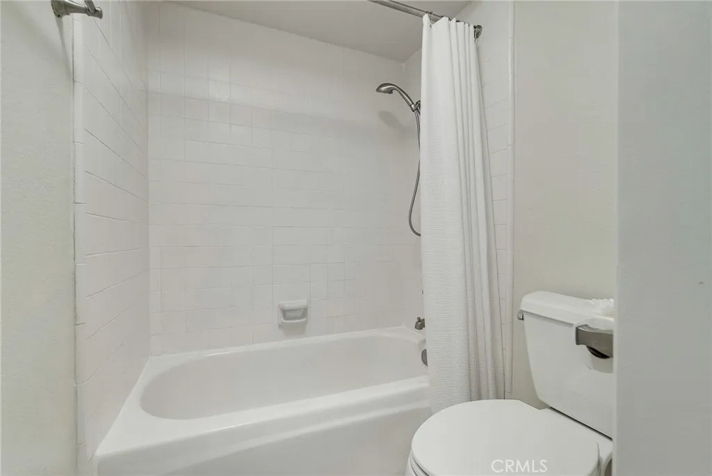 Upstairs bathroom private toilet area and shower in tub. Upstairs bathroom private toilet area and shower in tub.