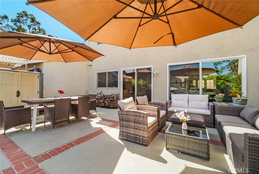 Another back view capturing two outdoor areas of back patio. Another back view capturing two outdoor areas of back patio.