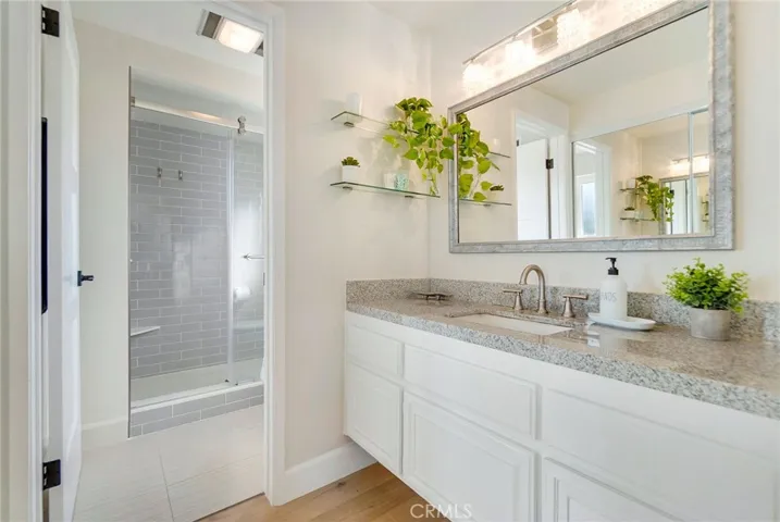 Private primary ensuite bathroom walk in shower and toilet area.