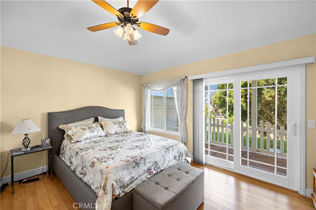 Primary bedroom with a slider to back patio