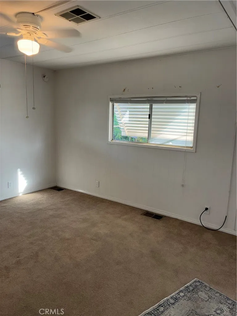 Primary Bedroom carpets low pile berber taupe window outside awnings steel (stay) inside blinds Primary Bedroom carpets low pile berber taupe window outside awnings steel (stay) inside blinds