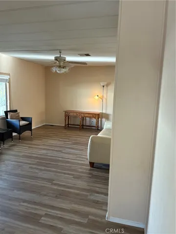 Family area and in front of  Laundry room wood paneled dor are looking towards the living room with newly installed 1