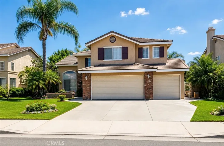 Beautiful two-story home with welcoming front entry and 3-car garage