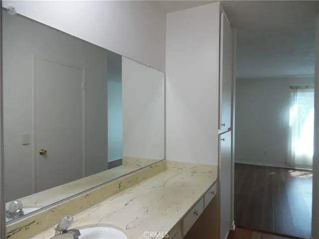 Bathroom, linen closet and bedroom