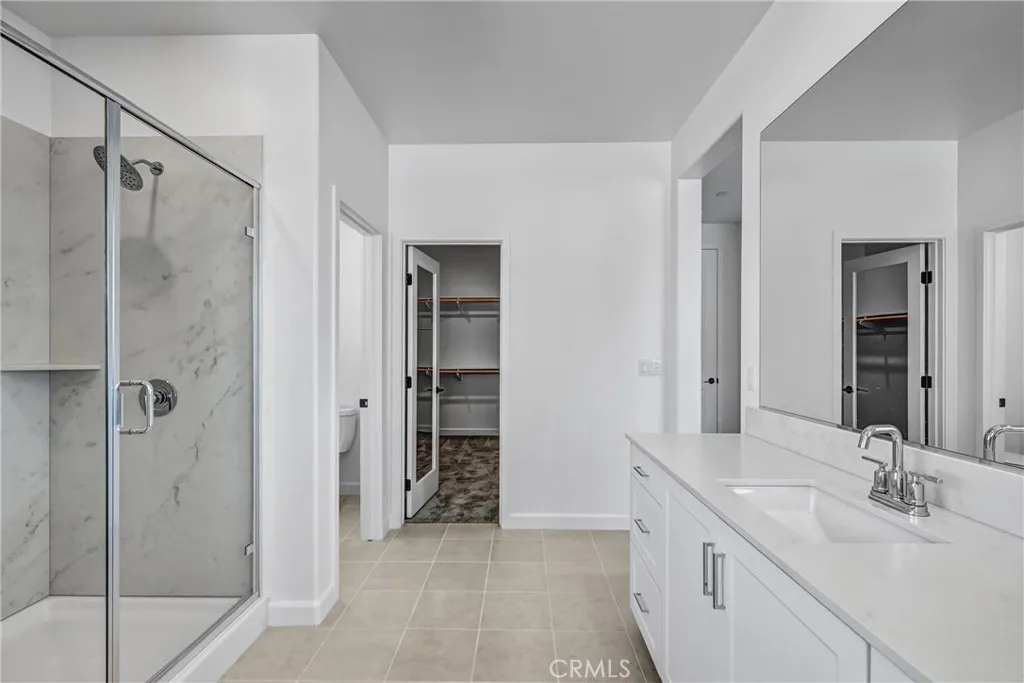Primary ensuite bathroom with walk in closet Primary ensuite bathroom with walk in closet