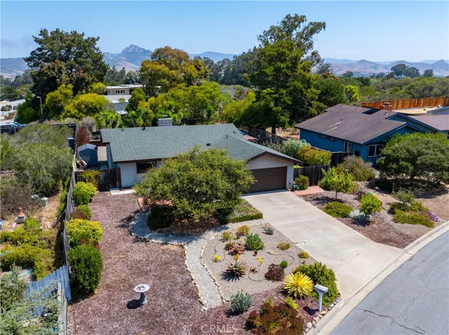 This home is set back toward the rear of the lot to ensure maximum privacy, and it features a beautiful, drought-tolerant landscaped front yard