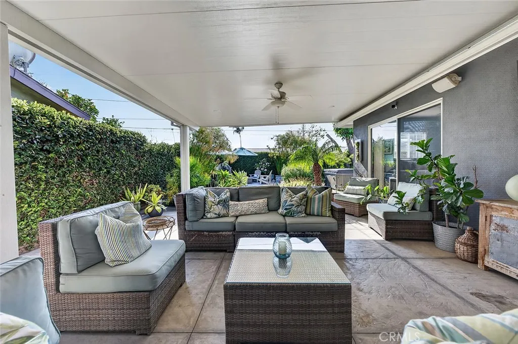 Lounge area leads to a fire pit and above ground spa.