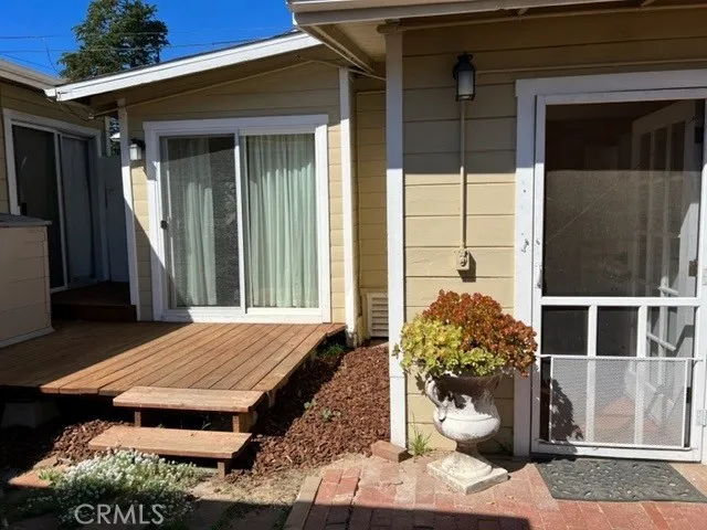 Entrance to the sweet cottage, 1bedroom, 1 bath, living room & kitchen. This photo shows the deck off of the bedroom