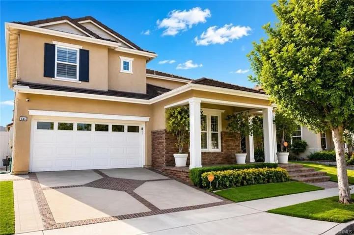 Beautifully updated Turnleaf residence showcasing inviting curb appeal and a welcoming covered front porch.