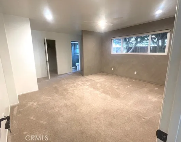 Primary bedroom with walk-in closet