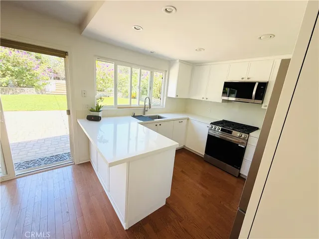 Brand NEW kitchen with breakfast bar facing expansive backyard. Easy to entertain.