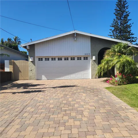 Exterior - facing 8th Street with plenty of off street driveway parking and 2 car garage