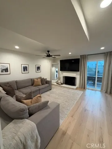 LIVING ROOM WITH SLIDER LEADING TO PATIO