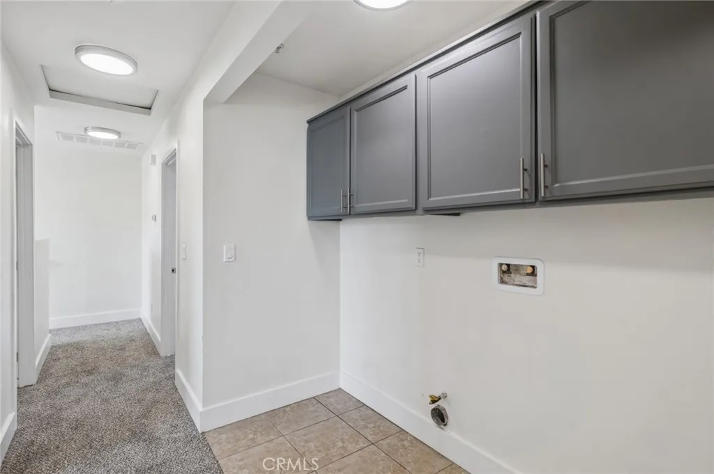 Upstairs laundry nook fits full sized machines