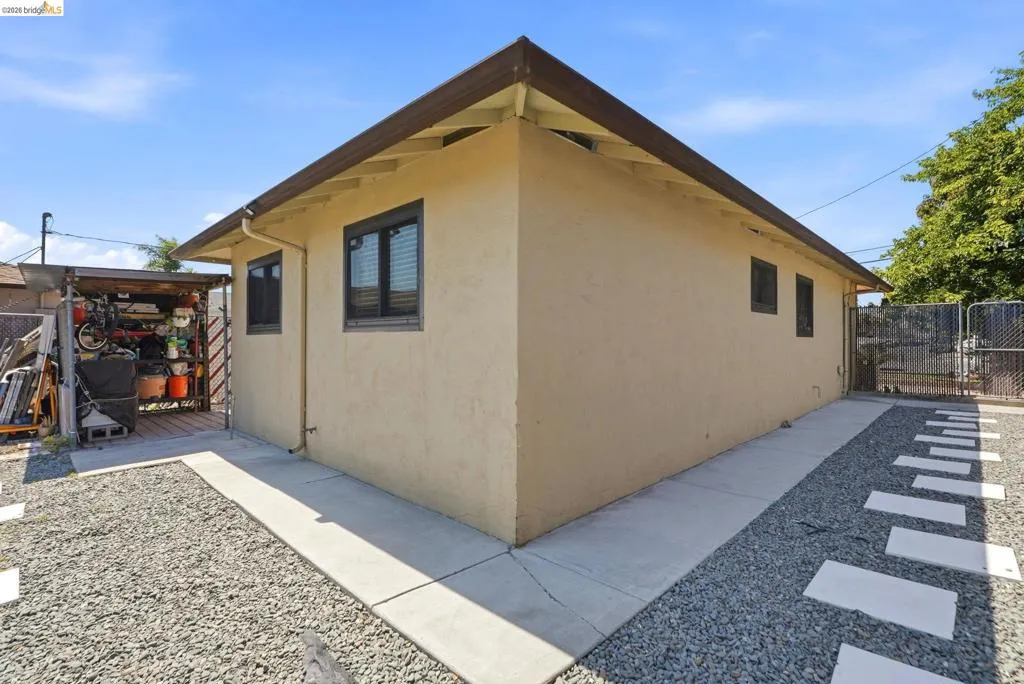 Stucco exterior with multiple windows