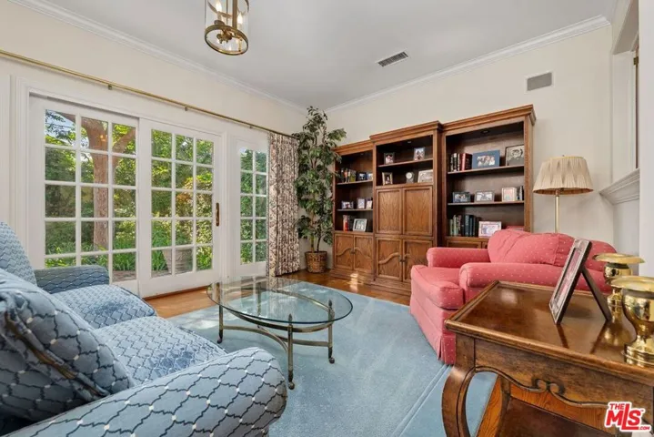Den with French door overlooki