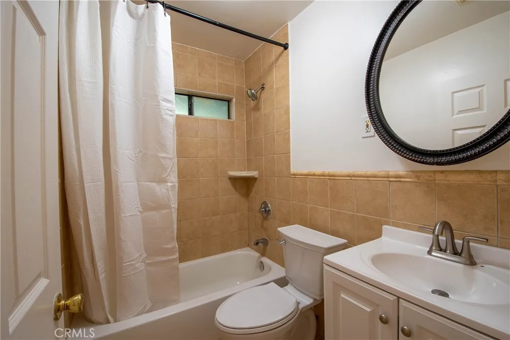 Spacious updated bathroom with shower and vanity.