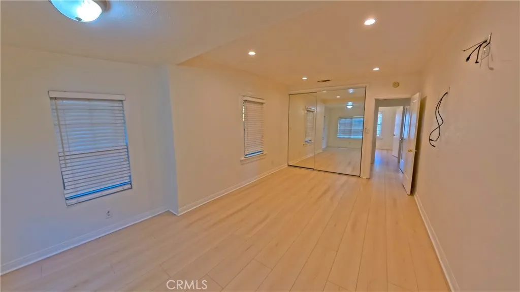 Spacious primary suite created by combining two original bedrooms.