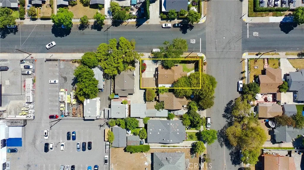 Elevated view highlighting the home’s location and mature landscaping.