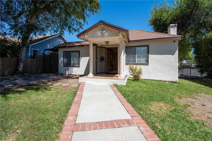 Freshly painted exterior with inviting front entry and outstanding curb appeal.