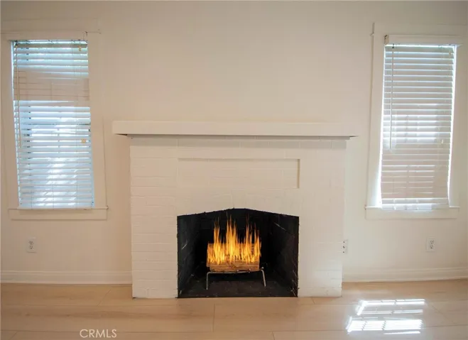 Cozy fireplace creates a warm focal point for the living room.