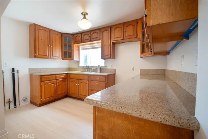 Bright kitchen with abundant cabinetry and generous workspace.