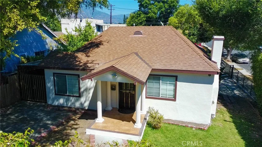 Stunning aerial view showcasing the charming home and desirable corner lot.