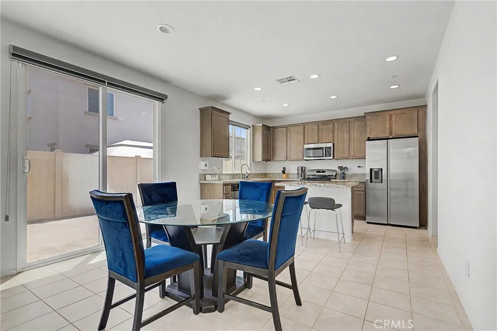 Spacious dining area with ample natural light, perfect for hosting and entertaining.