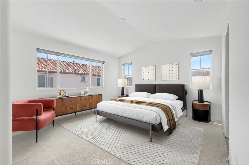 Spacious master bedroom with ample natural light and custom features.