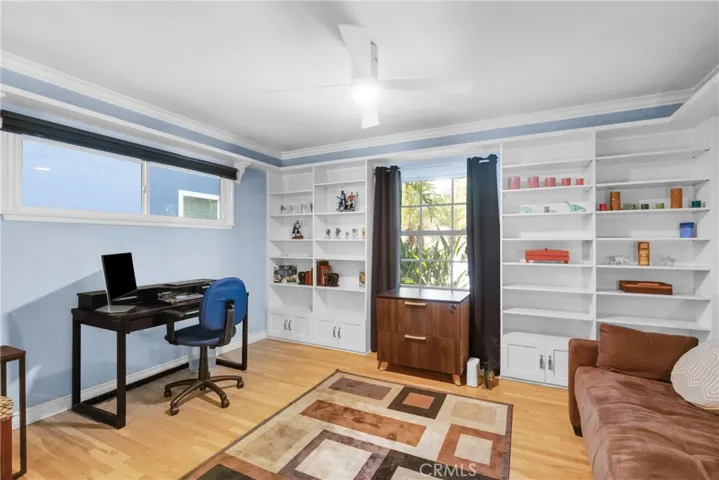 Bedroom three with built in shelves