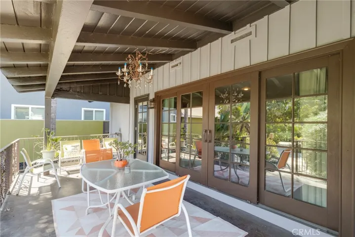 Back covered patio with stunning wrought iron railings
