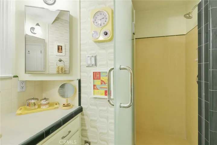 Bathroom with carefully selected vintage wallpaper
