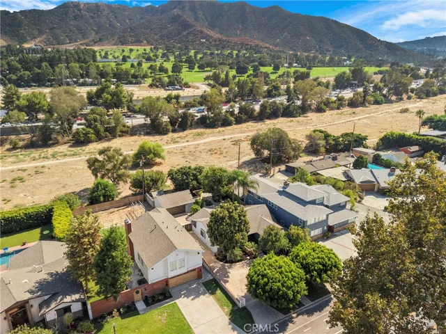 Front of house with back mountain view