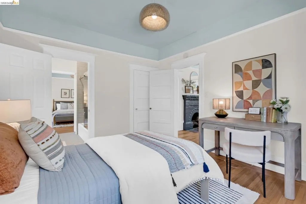 White paneled doors, light-toned walls, and wood-finish flooring