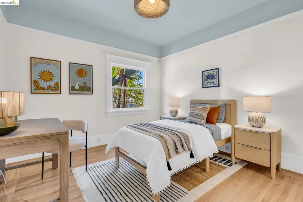 Hardwood-finish flooring, white walls, and a painted ceiling