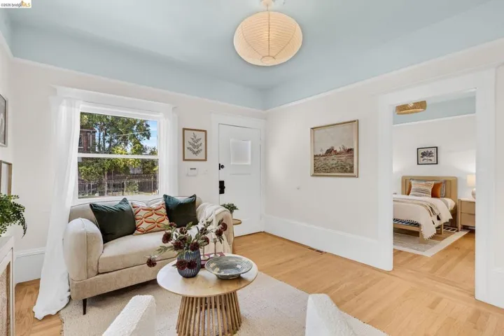 Hardwood flooring, painted ceiling, recessed window, interior doorway, and built-in door
