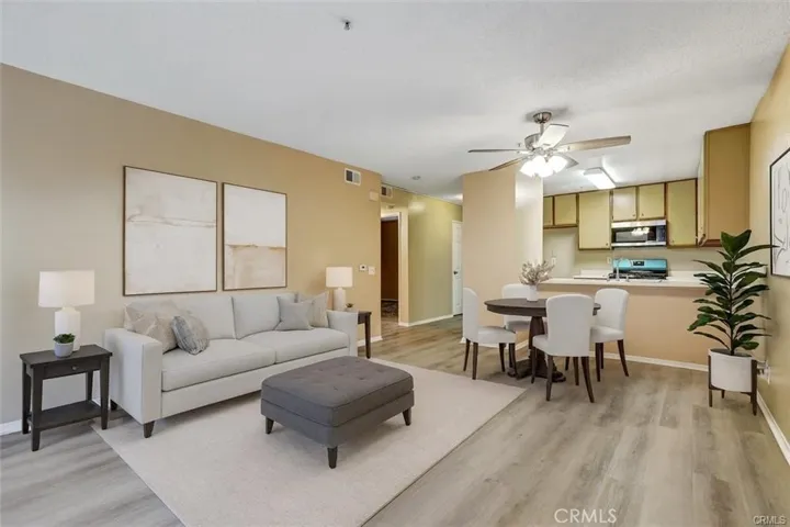 Spacious Living room opens to dining area_digital staged