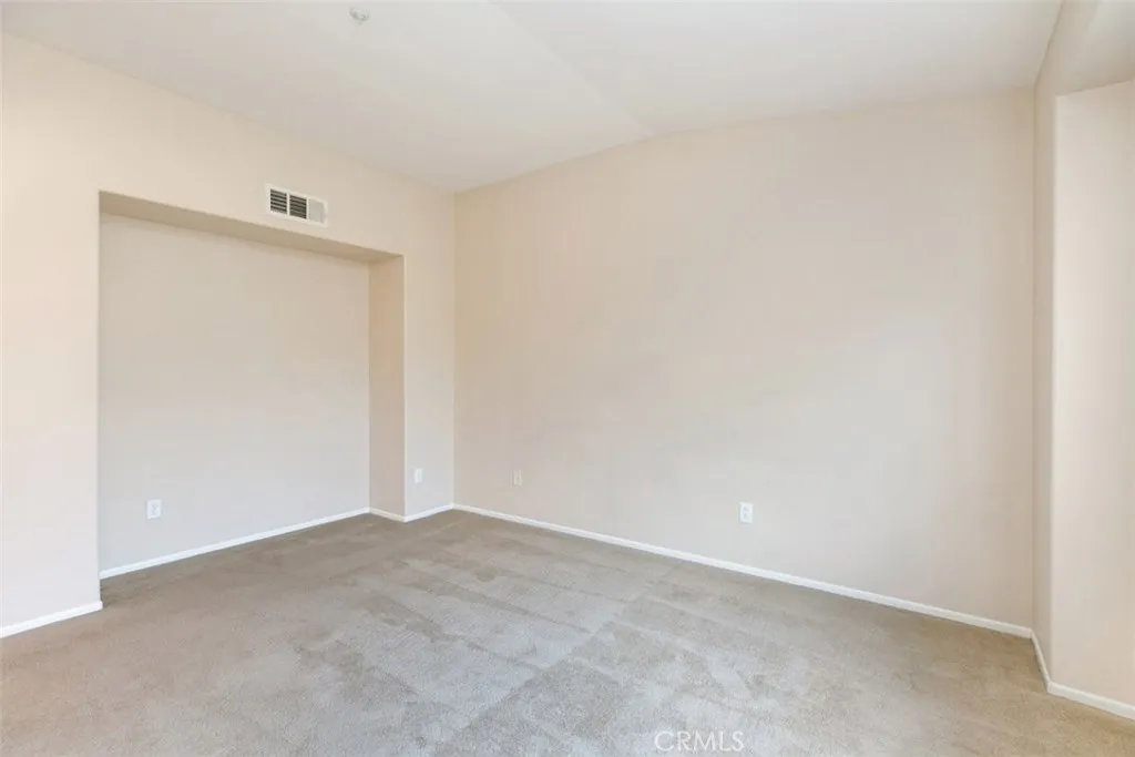 Master bedroom with vaulted ceiling and media/dresser niche. *flooring to be updated with LVP prior to move-in. Master bedroom with vaulted ceiling and media/dresser niche. *flooring to be updated with LVP prior to move-in.