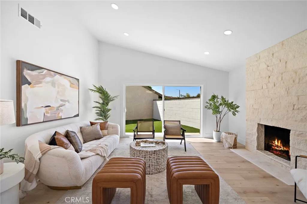 Step inside to a light-filled, open-flowing interior with wide passages, vaulted ceilings, luxury wide-plank vinyl flooring, LED recessed lighting, dual-pane windows/sliders w/custom casements, designer light fixtures, and A/C with a “smart” Venstar thermostat.