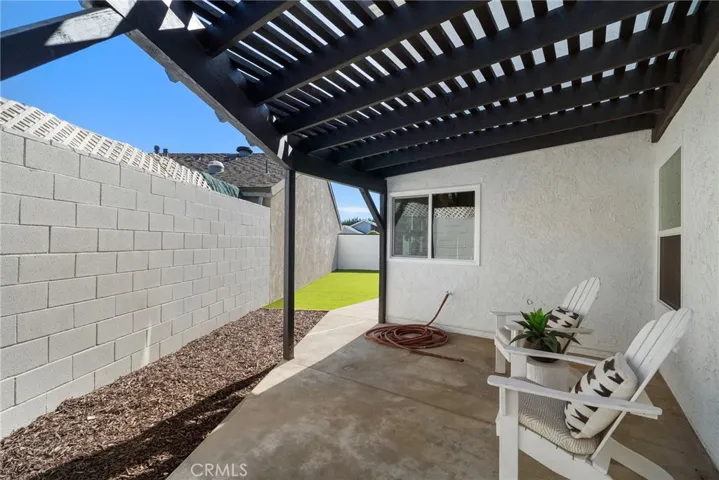 Side yard also has a place to entertain and relax in