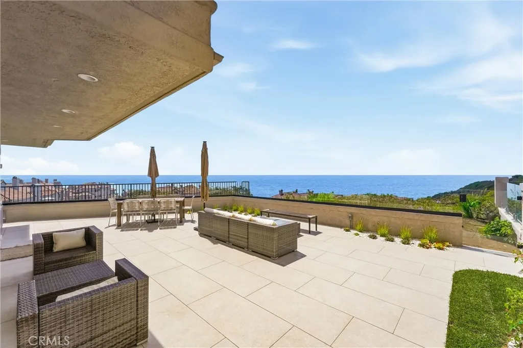 Expansive entertaining patio with breathtaking panoramic Pacific Ocean views Expansive entertaining patio with breathtaking panoramic Pacific Ocean views