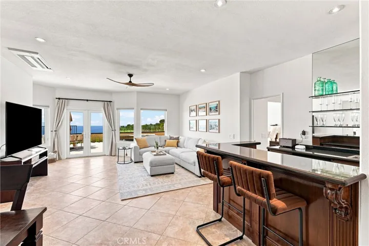 Lower-level family room with full wet bar & gorgeous panoramic views