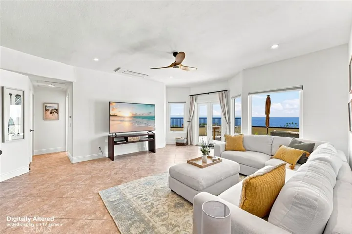 Oversized seating, new TV & double-door access to an expansive patio with endless views