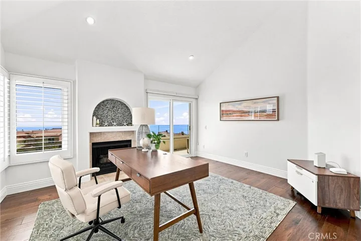 Office off the entry with fireplace, deck & beautiful views