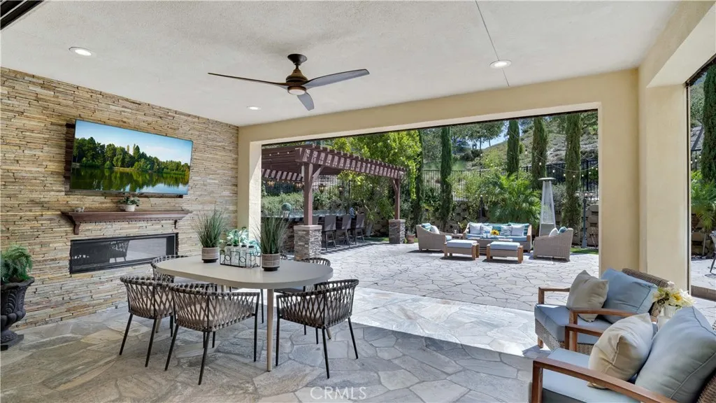 Downstairs California room offering a comfortable indoor-outdoor living and entertaining space Downstairs California room offering a comfortable indoor-outdoor living and entertaining space