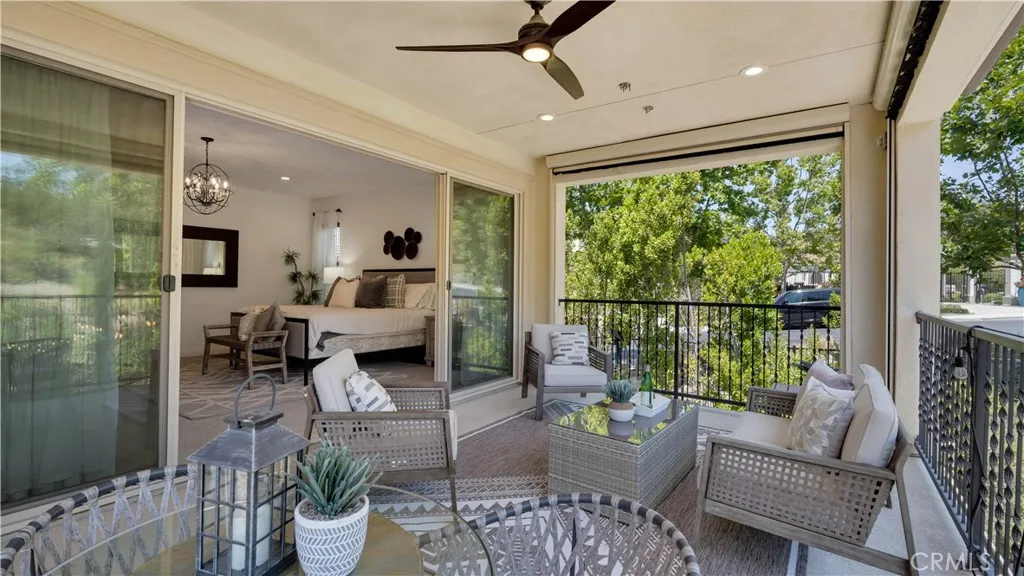 Covered outdoor living space extending the primary suite outdoors Covered outdoor living space extending the primary suite outdoors