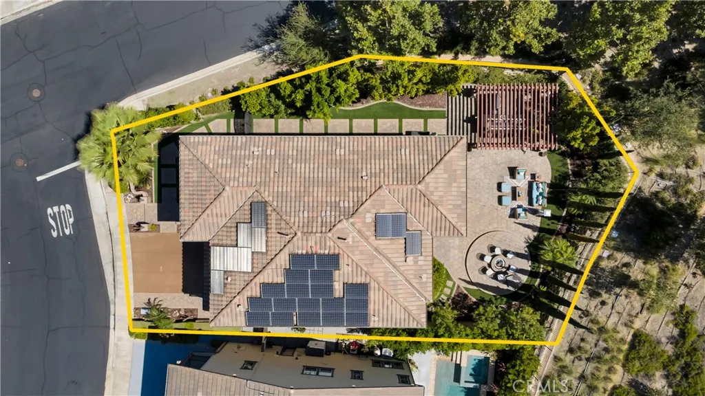 Overhead view showcasing the home, backyard, and overall property Overhead view showcasing the home, backyard, and overall property
