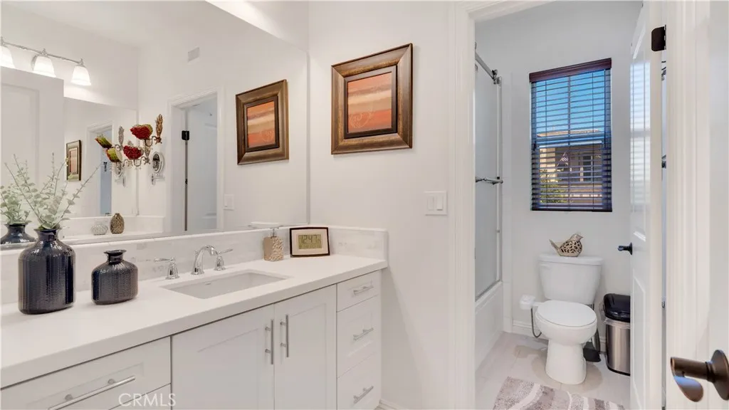 Upstairs secondary bathroom with dual-sink vanity Upstairs secondary bathroom with dual-sink vanity