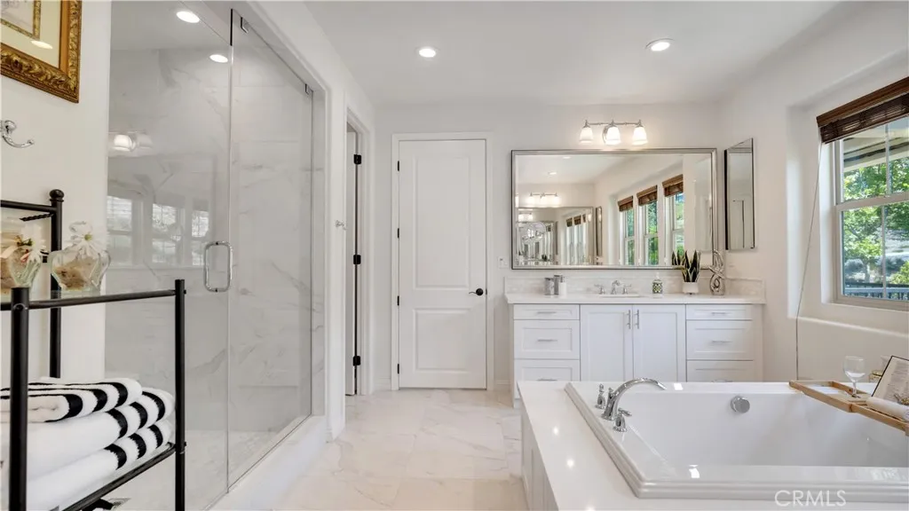 Another perspective highlighting the primary bathroom’s spacious design Another perspective highlighting the primary bathroom’s spacious design